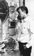 Photograph of Andy Warhol on the Phone at the Factory, by Billy Name